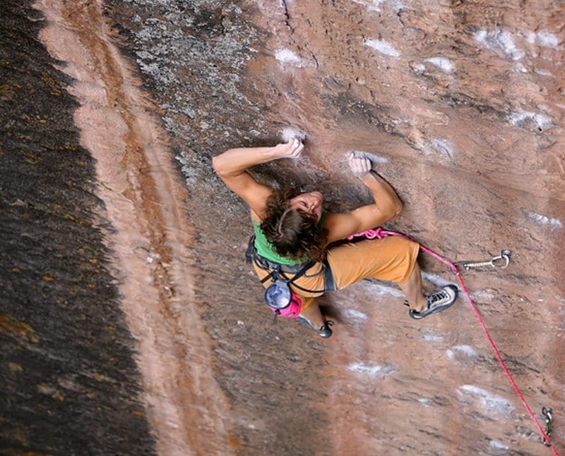 Abbey Smith crimps her way up 'Technochrist' 5.12c. Millcreek Canyon, Moab, Utah